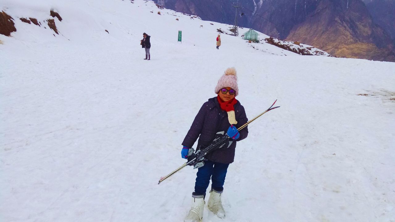 Kids learning to snow ski on the slopes of Auli