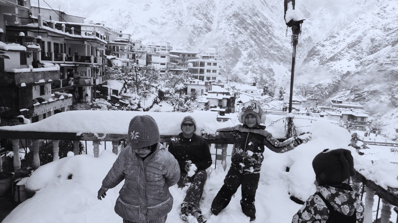 Children playing in the snow during vacation