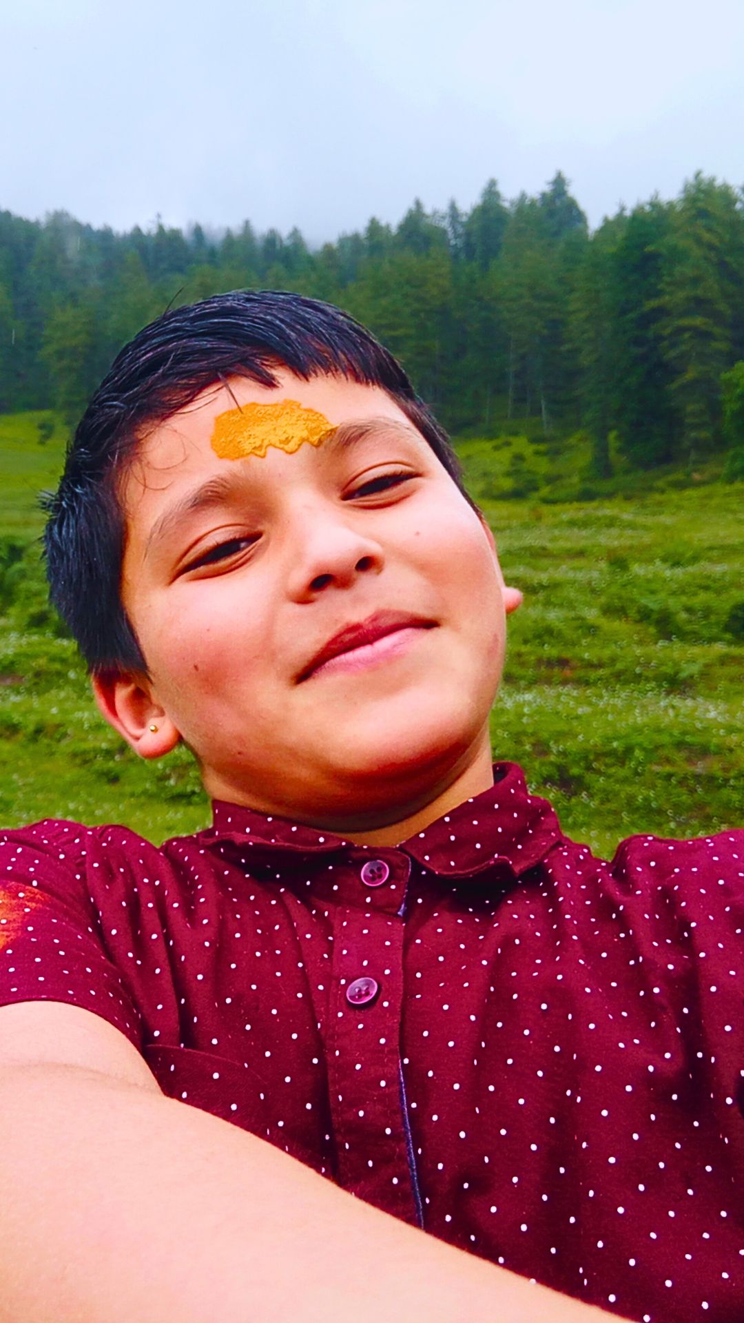 Near the Bhavishya Badri Temple with green grassland and deodar forest in the backdrop